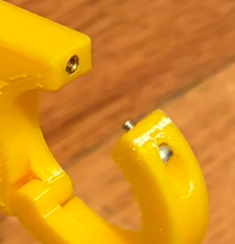 Heat-set threaded insert installed in PETG bicycle mount